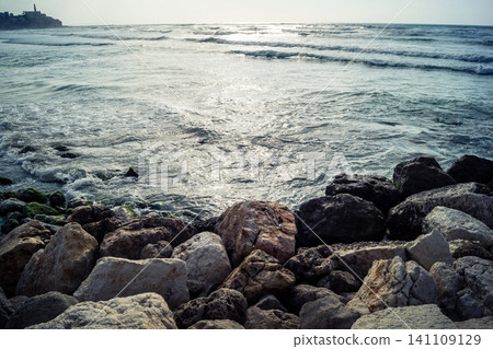 Waves crashing against the rocky coastline with a view of the Mediterranean Sea in Tel Aviv Waves crashing against the rocky coastline with a view of the Mediterranean Sea in Tel Aviv 141109129