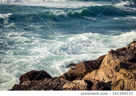 Waves crashing against the rocky coastline with a view of the Mediterranean Sea in Tel Aviv Waves crashing against the rocky coastline with a view of the Mediterranean Sea in Tel Aviv 141109133
