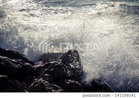 Waves crashing against the rocky coastline with a view of the Mediterranean Sea in Tel Aviv Waves crashing against the rocky coastline with a view of the Mediterranean Sea in Tel Aviv 141109141