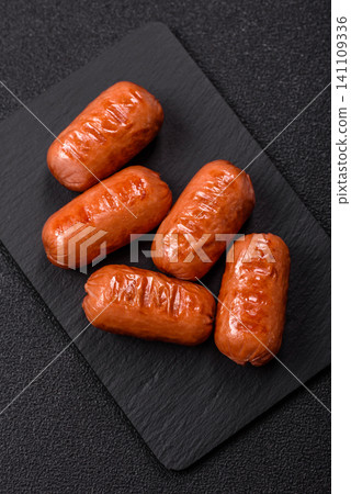 Chicken or pork grilling sausages with garlic, salt, and spices. Grilling sausages Chicken or pork grilling sausages with garlic, salt, and spices. Grilling sausages 141109336