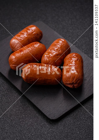 Chicken or pork grilling sausages with garlic, salt, and spices. Grilling sausages 141109337