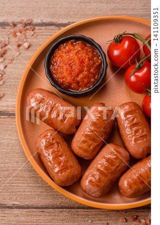Chicken or pork grilling sausages with garlic, salt, and spices. Grilling sausages 141109351