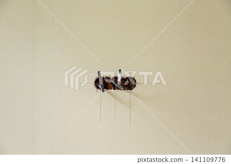 Modern house renovation with exposed electrical wiring 141109776