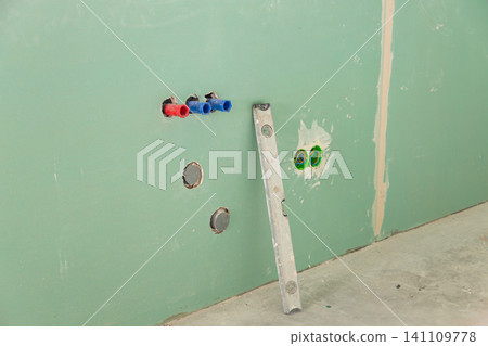 Home renovation with plumbing system installation on green background Home renovation with plumbing system installation on green background 141109778