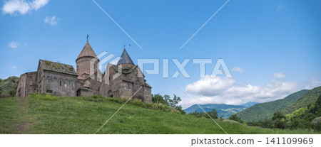 Wide panorama of Goshavank monastery in mountains under blue sky with copy space Wide panorama of Goshavank monastery in mountains under blue sky with copy space 141109969