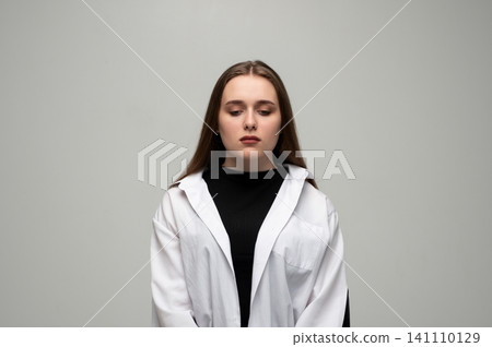 Young woman feeling down, reflecting sadness and despair, experiencing depression and mental health issues, looking away from camera Young woman feeling down, reflecting sadness and despair, experiencing depression and mental health issues, looking away from camera 141110129