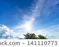 Early summer blue sky, clouds, and trees 141110773