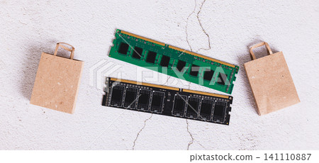 Computer memory modules RAM and shopping bags top view web banner Computer memory modules RAM and shopping bags top view web banner 141110887