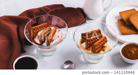 Japanese cheesecake made with cream cheese, cookies, and berry jam in cups on a table web banner Japanese cheesecake made with cream cheese, cookies, and berry jam in cups on a table web banner 141110948