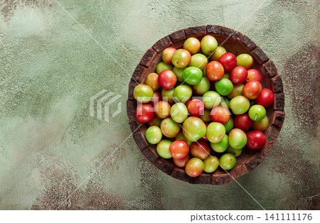 cherry plum tkemali, fruit, plum variety, in a wooden plate, Georgian cuisine, top view, no people, cherry plum tkemali, fruit, plum variety, in a wooden plate, Georgian cuisine, top view, no people, 141111176