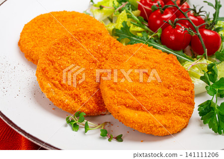 crispy fried fish cutlets, fish burgers, on a white plate, with fresh lettuce leaves, arugula and cherry tomatoes, homemade, no people, crispy fried fish cutlets, fish burgers, on a white plate, with fresh lettuce leaves, arugula and cherry tomatoes, homemade, no people, 141111206