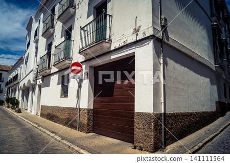 Traditional white-washed narrow streets and historical Andalusian architecture in Carmona 141111564
