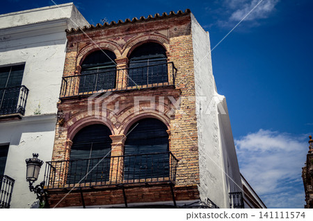 Traditional white-washed narrow streets and historical Andalusian architecture in Carmona 141111574