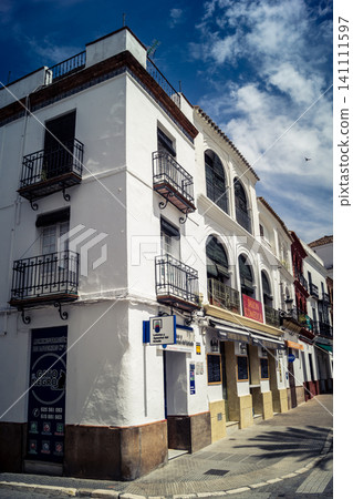 Traditional white-washed narrow streets and historical Andalusian architecture in Carmona Traditional white-washed narrow streets and historical Andalusian architecture in Carmona 141111597