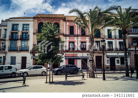 Traditional white-washed narrow streets and historical Andalusian architecture in Carmona Traditional white-washed narrow streets and historical Andalusian architecture in Carmona 141111601