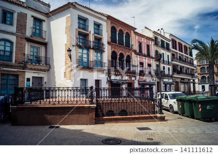 Traditional white-washed narrow streets and historical Andalusian architecture in Carmona Traditional white-washed narrow streets and historical Andalusian architecture in Carmona 141111612