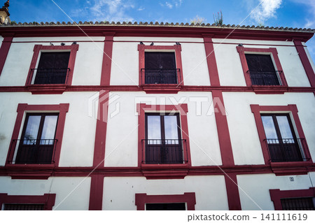 Traditional white-washed narrow streets and historical Andalusian architecture in Carmona Traditional white-washed narrow streets and historical Andalusian architecture in Carmona 141111619