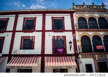 Traditional white-washed narrow streets and historical Andalusian architecture in Carmona Traditional white-washed narrow streets and historical Andalusian architecture in Carmona 141111620