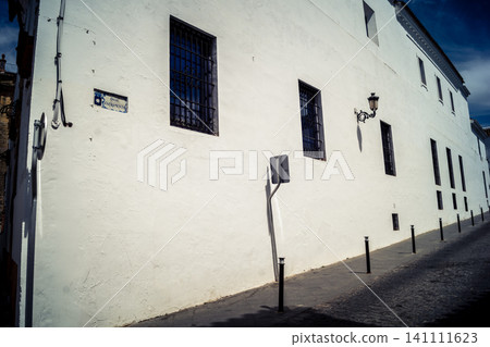 Traditional white-washed narrow streets and historical Andalusian architecture in Carmona Traditional white-washed narrow streets and historical Andalusian architecture in Carmona 141111623
