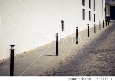 Traditional white-washed narrow streets and historical Andalusian architecture in Carmona Traditional white-washed narrow streets and historical Andalusian architecture in Carmona 141111625