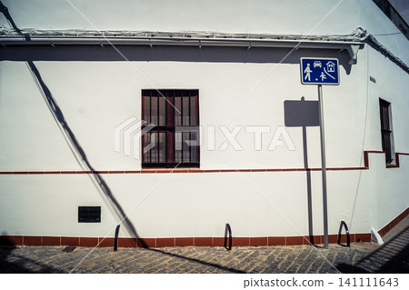 Traditional white-washed narrow streets and historical Andalusian architecture in Carmona Traditional white-washed narrow streets and historical Andalusian architecture in Carmona 141111643