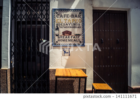 Traditional white-washed narrow streets and historical Andalusian architecture in Carmona Traditional white-washed narrow streets and historical Andalusian architecture in Carmona 141111671