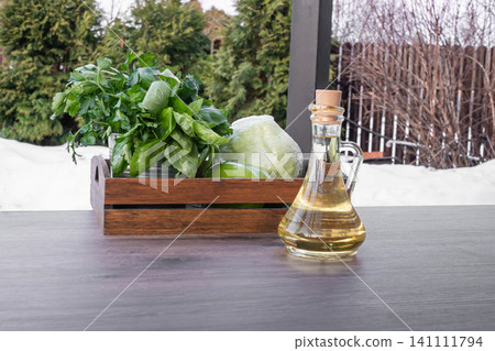 Olive Oil Bottle With Fresh Vegetables Outdoor Cooking Concept Olive Oil Bottle With Fresh Vegetables Outdoor Cooking Concept 141111794