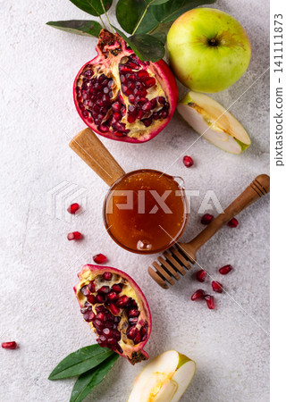 Rosh Hashana concept with honey, apple and pomegranate Rosh Hashana concept with honey, apple and pomegranate 141111873