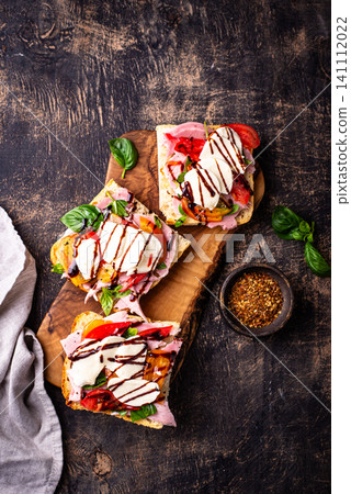 Italian ciabatta with mozzarella and prosciutto Italian ciabatta with mozzarella and prosciutto 141112022