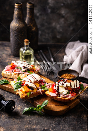 Italian ciabatta with mozzarella and prosciutto Italian ciabatta with mozzarella and prosciutto 141112033