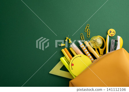 Yellow school supplies overflowing from pencil case 141112106