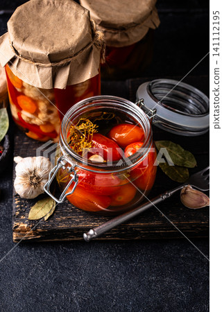 Marinated pickled tomatoes in jar Marinated pickled tomatoes in jar 141112195