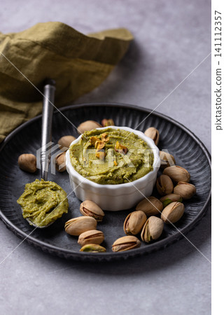 Sweet pistachio cream in a bowl Sweet pistachio cream in a bowl 141112357