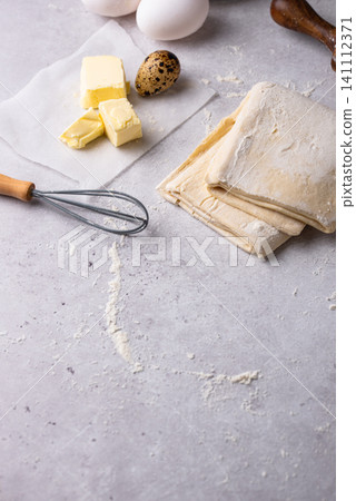 Raw puff pastry dough with baking ingredient Raw puff pastry dough with baking ingredient 141112371