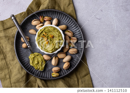 Sweet pistachio cream in a bowl Sweet pistachio cream in a bowl 141112510