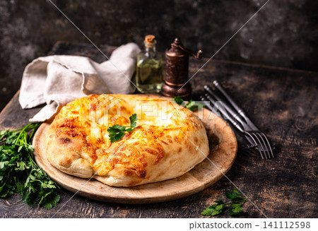 Khachapuri with cheese, Georgian cuisine Khachapuri with cheese, Georgian cuisine 141112598