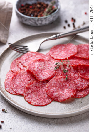 Sliced spicy tasty salami sausage Sliced spicy tasty salami sausage 141112645