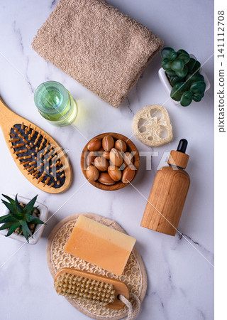 Moroccan argan seeds and oil for hair care Moroccan argan seeds and oil for hair care 141112708