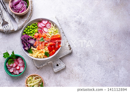 Balanced healthy bowl with vegetables and salmon Balanced healthy bowl with vegetables and salmon 141112894