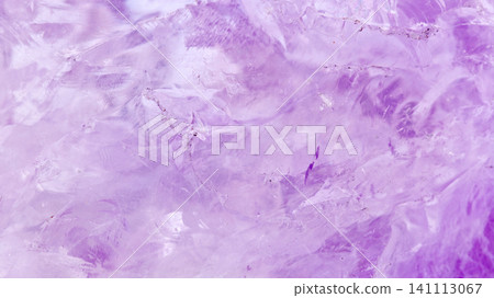 amethyst crystal displays frozen textures with cool Purple hues. The icy surface of the gemstone amethyst crystal displays frozen textures with cool Purple hues. The icy surface of the gemstone 141113067