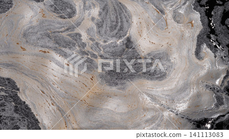 Swirling foam, dark slick patches, and pale mineral like streaks spread across water surface, forming abstract organic patterns with strong contrast and clear signs of 141113083