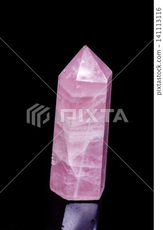 Macro mineral pink quartz crystal on a black background Macro mineral pink quartz crystal on a black background 141113116