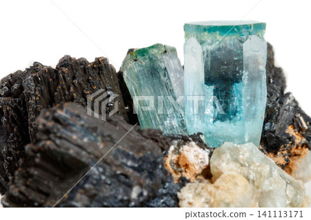 Macro mineral stone Aquamarine and black tourmaline, Schorl on a white background Macro mineral stone Aquamarine and black tourmaline, Schorl on a white background 141113171
