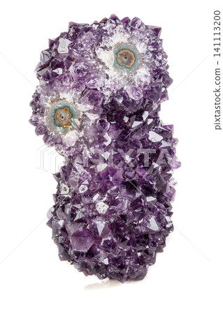 Macro mineral stone Amethyst eye, in the form of an owl on a white background Macro mineral stone Amethyst eye, in the form of an owl on a white background 141113200