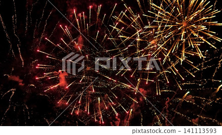 Vivid fireworks exploding across dark night sky with golden starbursts, red spark trails, glowing smoke clouds, layered bursts, dramatic contrast, radiant festive energy Vivid fireworks exploding across dark night sky with golden starbursts, red spark trails, glowing smoke clouds, layered bursts, dramatic contrast, radiant festive energy 141113593