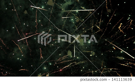 Bright fireworks burst across dark night sky, scattering long glowing streaks, sparkling trails, and smoky clouds in festive celebration scene with dramatic contrast and vivid Bright fireworks burst across dark night sky, scattering long glowing streaks, sparkling trails, and smoky clouds in festive celebration scene with dramatic contrast and vivid 141113639