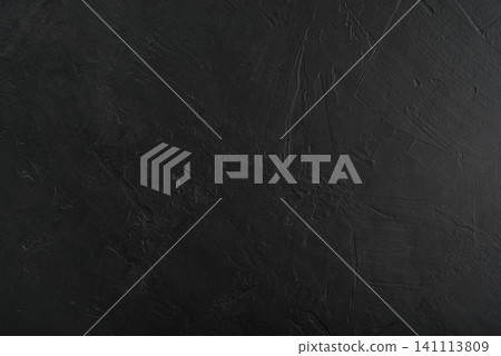 Black textured concrete wall background with trowel strokes. 141113809