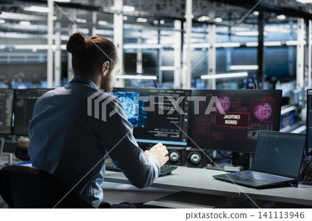 Server room computer scientist trying to fix system faults working with AI program. Server room computer scientist trying to fix system faults working with AI program. 141113946