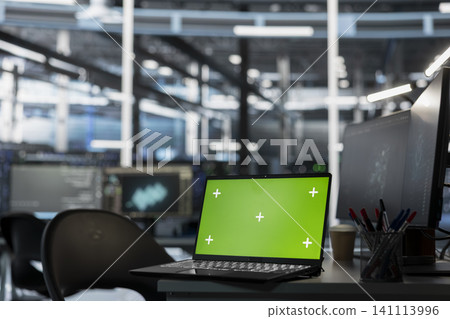 Green screen laptop in a data center supports AI systems, screen replacement, and editable monitoring workflows. Green screen laptop in a data center supports AI systems, screen replacement, and editable monitoring workflows. 141113996