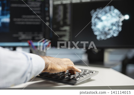 Server room engineer working with AI visual analytics tools on computer to detect equipment system faults. Server room engineer working with AI visual analytics tools on computer to detect equipment system faults. 141114015